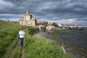 Female hiker, walking on the Fife Coast Path, Scotland