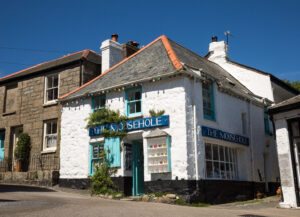 Mousehole, Cornwall, The popular tourist destination of Mousehole in Cornwall, UK showing the traditional gift shop known as The Mousehole South West Coast Path