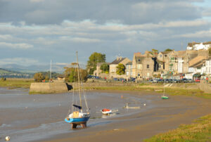 Sunny evening in Arnside, Lancashire, on the edge of Morecombe Bay, tide out. King Charles II Coast Path England