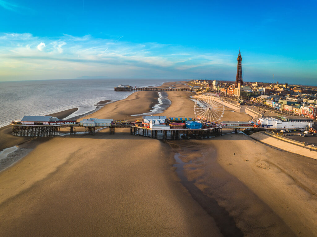 Blackpool - the ultimate Victorian seaside resort - shows Blackpool tower and both piers